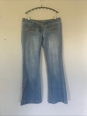 Woman’s Seduction Light Blue Flare Jeans with Front Zip Pocket Accents